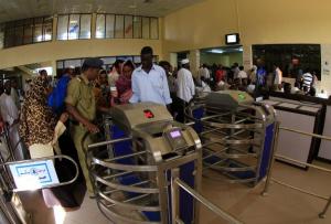 Passengers pass through the gates on the platform to get on Sudan's Nile Train, in Khartoum